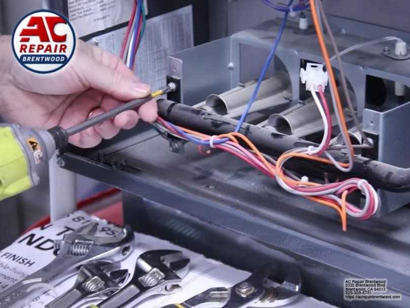 Heating repair technician servicing a furnace in Brentwood, CA
