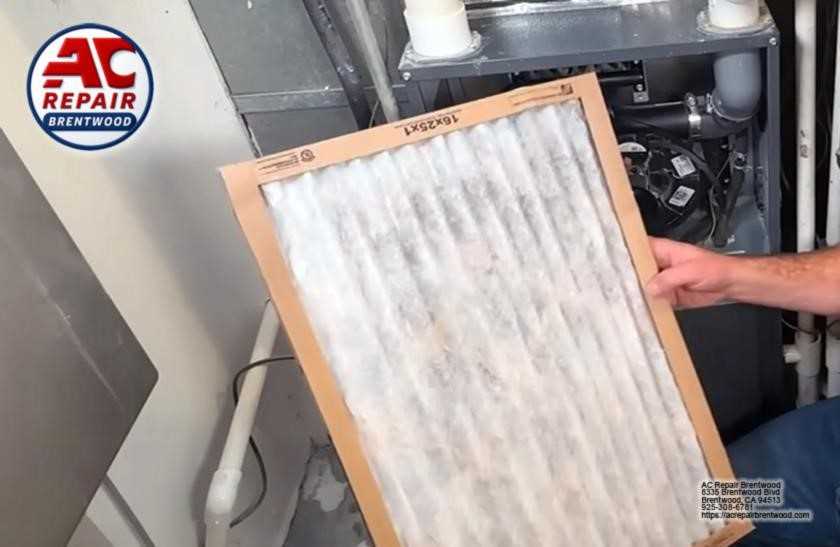 Technician performing system inspection during heating maintenance service