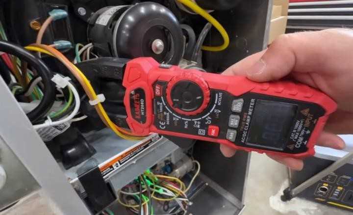 Serivice technician repairing a furnace/heating system in Brentwood, CA